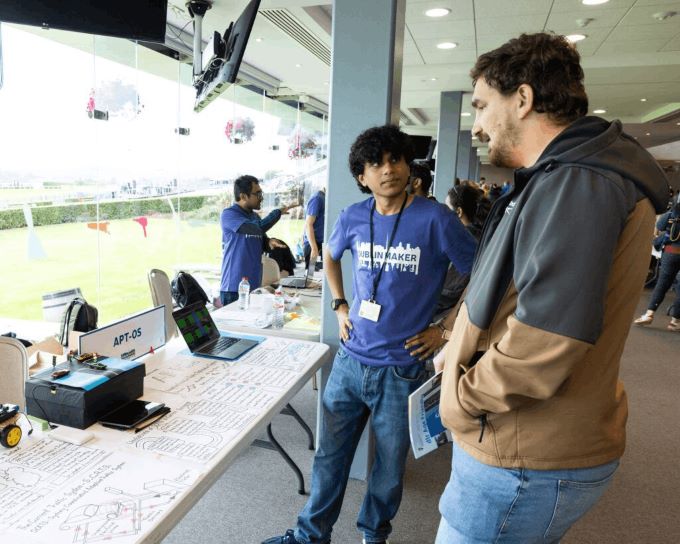 Arjun speaking with visitors at Dublin Maker
