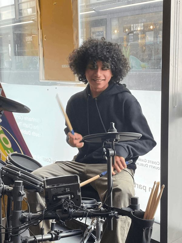 Arjun playing electronic drums