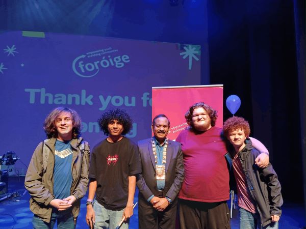Arjun and bandmates on stage after a performance