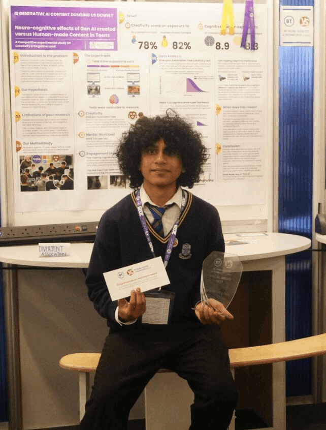 Arjun seated in front of the neurocognitive research poster with award