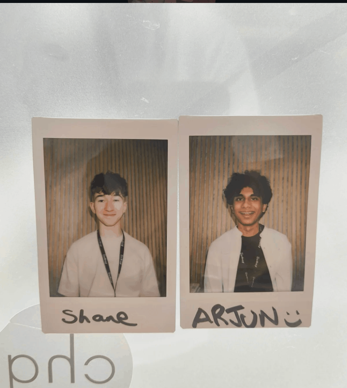 Polaroid portraits of Shane and Arjun from the accelerator