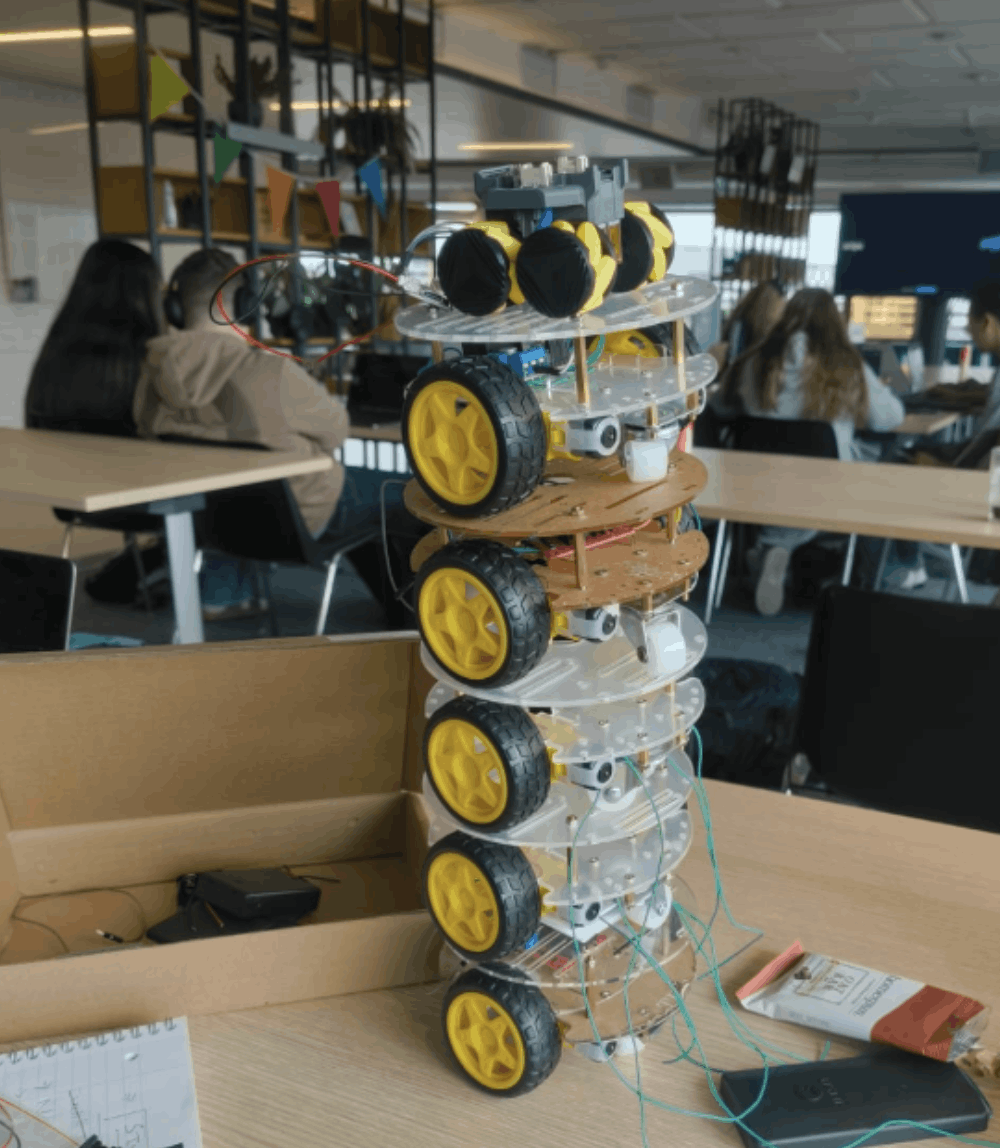 A vertical stack of five custom Swarm Inc. robots during development