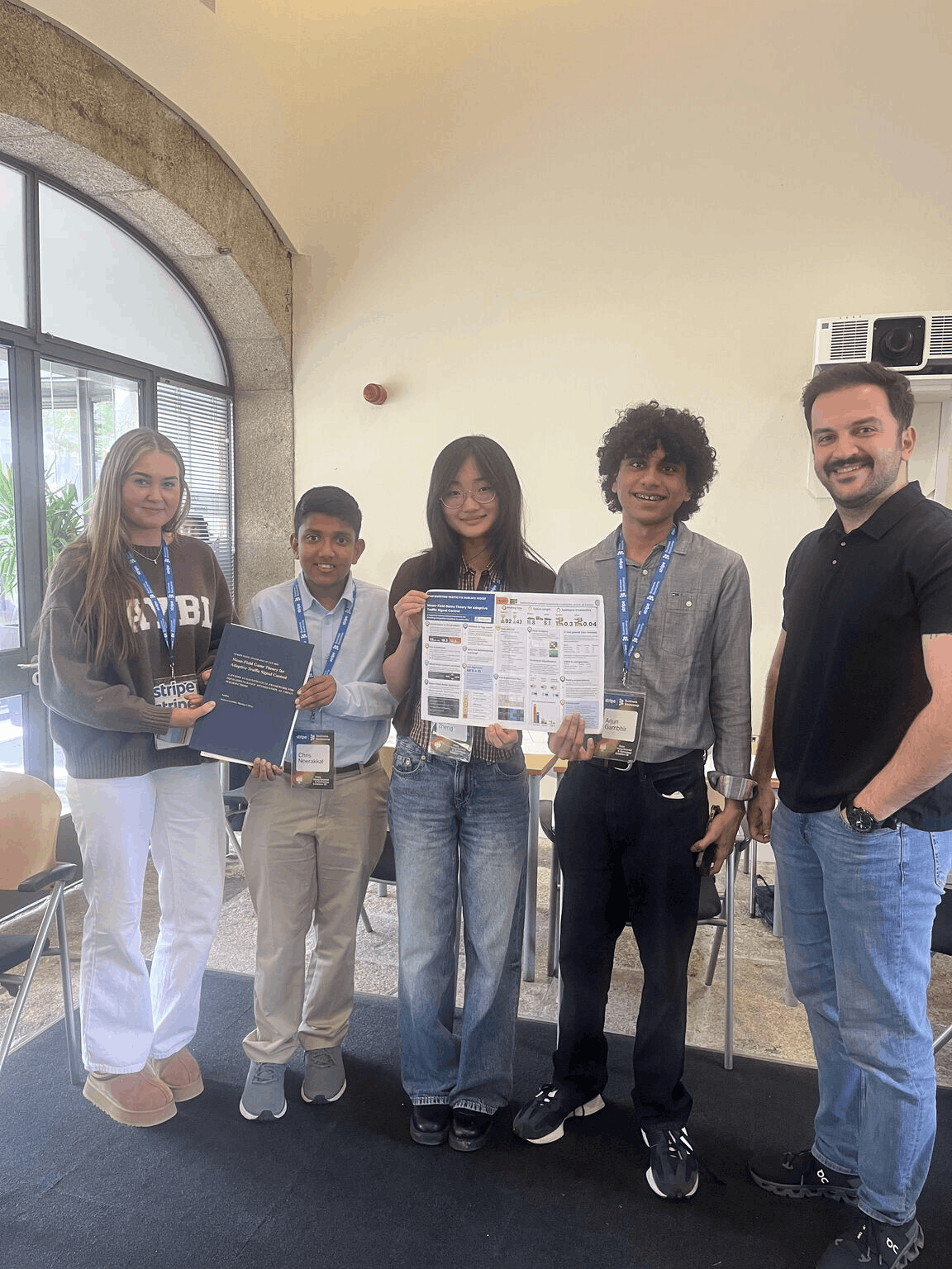 Arjun with Stripe YSTE Bootcamp teammates holding project work